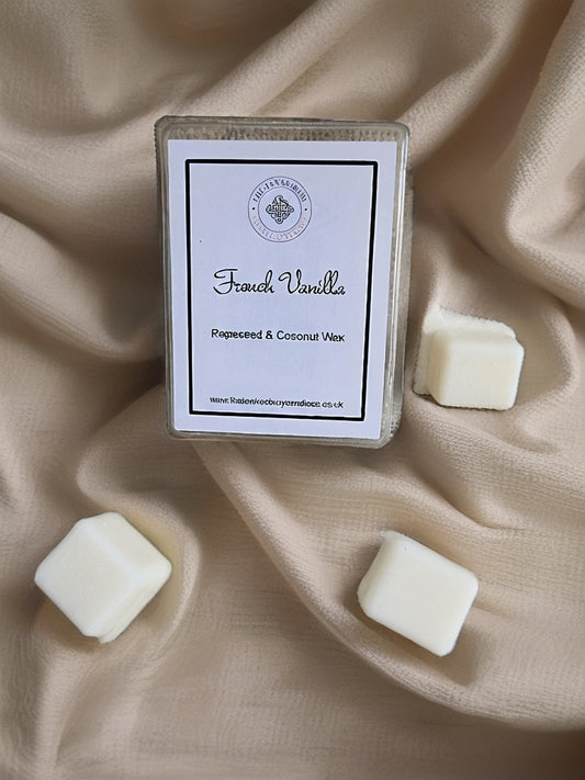 Box of French Vanilla wax melts on a beige fabric background